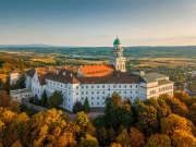 Fantastic arieal photo of Pannonhalama Benedictine abbey in Hungary. Amazing historical building with a beautiful church and library. Popular tourist destination with guided tours