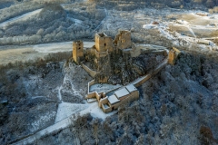 snowy aerial photo about Csesznek castle ruins in Bakony Mountain Hungary. Built was by Jakab Cseszneki in 1263. Amazing historical building ruins.