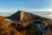 Amazing geological formatoion with fog. Basalt columns hill in upper Balaton region in Hungary. The hungarian name is Hegyesstu.