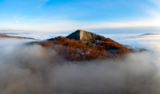 Amazing geological formatoion with fog. Basalt columns hill in upper Balaton region in Hungary. The hungarian name is Hegyesstu.