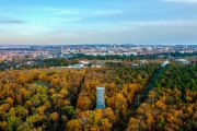 Splendid lookout tower next to veszperm city in Hungary. Fantastic fall mood in this photo. Vezprem cityscape on the background