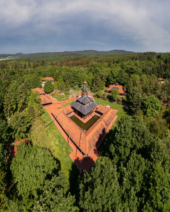 Aerial photo about Nepal Tibet pavilion in Germany. Spiritual temple tower with hanging flags. Time for meditation and thoughts in the Nepal Himalaya.