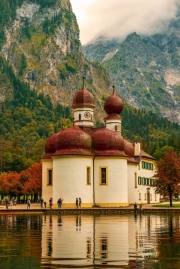 Konigsee lake with st Bartholomew church surrounded by mountains, Berchtesgaden National Park, Bavaria, Germany