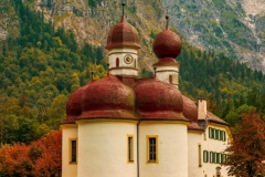 Konigsee lake with st Bartholomew church surrounded by mountains, Berchtesgaden National Park, Bavaria, Germany