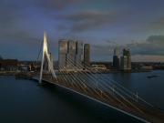 rotterdam citscape near by Erasmus bridge. Amazing colorful photo in sunset time.