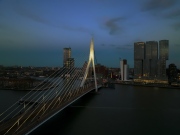 rotterdam citscape near by Erasmus bridge. Amazing colorful photo in sunset time.