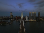 rotterdam citscape near by Erasmus bridge. Amazing colorful photo in sunset time.