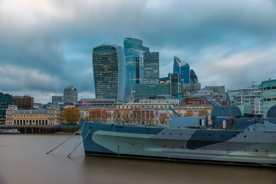 London cityscape with Belfast. London military museum. cloudly sky. Business district in the background