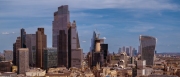 Panoramic aerial city scape about London city with skyscapers. Amazing sunny day with a bit cloudy sky.