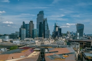 Panoramic aerial city scape about London city with skyscapers. Amazing sunny day with a bit cloudy sky.
