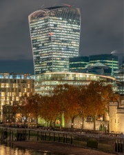London Cityscape about the bank of Thames river. Amazing skyscrapesrs, cloudly sky and splendid city lights. Autumn mood. Tower of London.