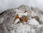 Aerial landscape from Hungar in Bukk Mountains. Scenic view about the Belko mountain andy Belapatfalva town's Cistercian abbey in winter time which coverd fresh snow