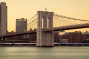 Amazing golden hour view about the Giant Brooklyn bridge over the East river in New York city. This bridge connects Manhattan and Brooklyn.