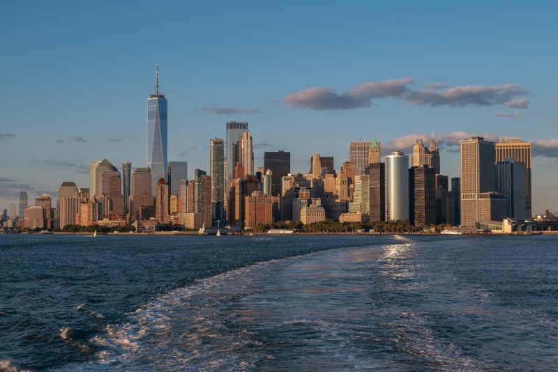 Panormic cityscape about Lower Manhattan from Staten island ferry. clear blues sky, clean air in the upper bay of Newy York city.