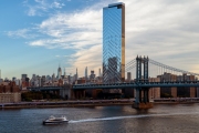 Unique view about the Manhattan bridge and the New york Ferry boat what connecting Brooklyn to Manhattan. This is a 2 levels bridge for subways, busses cars and trucks.