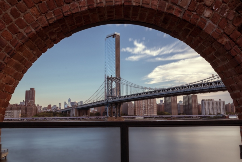 Framed view about the Manhattan bridge what connecting Brooklyn to Manhattan. This is a 2 levels bridge for subways, busses cars and trucks.