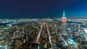 Amazing night view about Mahnattan, New York city, USA. Illuminated streets, buildings in a panoramic photo.