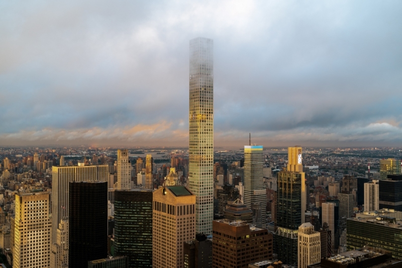 Epic sunset after the rain. Amazing aerial cityscape landscape about New York city, Manhattan. Famous skyscrapers on the photo. Cloud covered high lines.