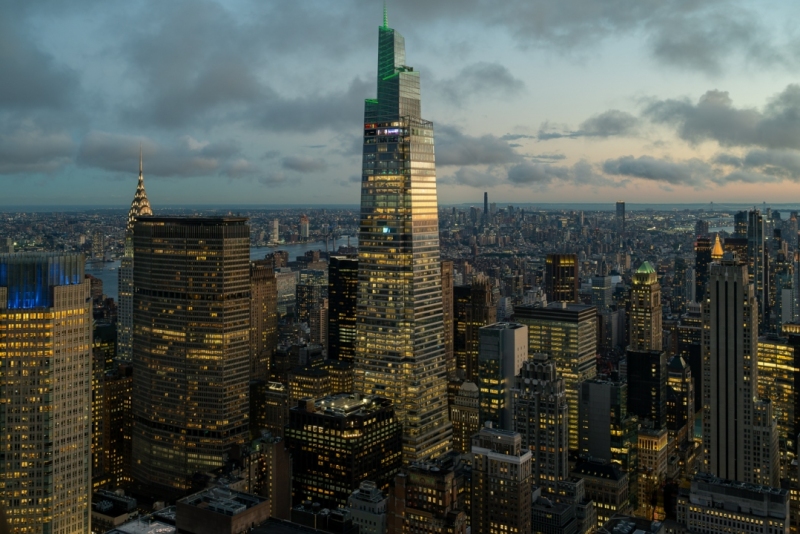 Epic sunset after the rain. Amazing aerial cityscape landscape about New York city, Manhattan. Famous skyscrapers on the photo. Cloud covered high lines.