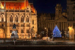 Hungarian parliament building at cristmas time. Amazing aerial view about the Hungaria government's building with giant christmas tree. The Government of Hungary's working here.
