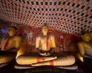 The Dambulla Cave Temple in Sri Lanka is a UNESCO World Heritage Site featuring over 150 Buddha statues and intricate murals within five sacred caves
