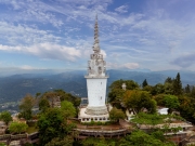 Ambuluwawa Tower in Gampola, Sri Lanka, stands tall atop a lush mountain, offering panoramic views and a unique spiral design symbolizing cultural and religious harmony