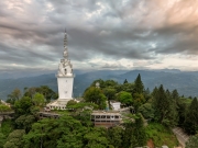 Ambuluwawa Tower in Gampola, Sri Lanka, stands tall atop a lush mountain, offering panoramic views and a unique spiral design symbolizing cultural and religious harmony