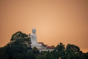 Sri Maha Bodhi Viharaya, located in Bahirawakanda, Kandy, Sri Lanka, is renowned for its towering 88-foot white Buddha statue in Dhyana Mudra, symbolizing meditation