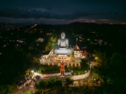 A panoramic view of Kandy, Sri Lanka, showcasing a vibrant cityscape nestled amidst lush green hills, with traditional buildings, bustling streets, and rich cultural landmarks.