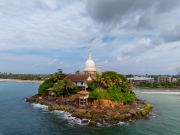 Parewi Duwa Temple is a serene Buddhist temple on a small island in Matara, Sri Lanka. Connected by a bridge, it offers stunning ocean views and a peaceful spiritual retreat.