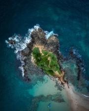 Mirissa sandy Parrot Rock island landmark aerial photo with a beautiful bay in Matara District on Sri Lanka. Exotic Asian countries and around the World traveling concept.