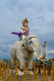 A majestic statue of Samantabhadra Bodhisattva riding a white elephant at Nelligala International Buddhist Centre, Sri Lanka, set against a panoramic mountain view.