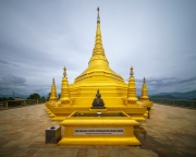 The golden pagoda at Nelligala International Buddhist Centre, Sri Lanka, radiates spiritual serenity, offering a breathtaking view of the surrounding mountains.