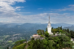 Ambuluwawa Tower in Gampola, Sri Lanka, stands tall atop a lush mountain, offering panoramic views and a unique spiral design symbolizing cultural and religious harmony