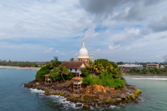 Parewi Duwa Temple is a serene Buddhist temple on a small island in Matara, Sri Lanka. Connected by a bridge, it offers stunning ocean views and a peaceful spiritual retreat.