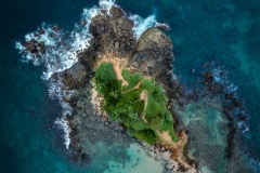 Mirissa sandy Parrot Rock island landmark aerial photo with a beautiful bay in Matara District on Sri Lanka. Exotic Asian countries and around the World traveling concept.
