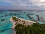 Famous overwater bungalows villas in the Maldives Islands. Crystal clear water in the Indian Ocean. Amazing lagoons with sandy beaches.