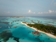 Famous overwater bungalows villas in the Maldives Islands. Crystal clear water in the Indian Ocean. Amazing lagoons with sandy beaches.