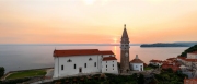 Panoramic photo about piran's old town in Slovenia Amazing morning lights in this peninsula with the Zvonik Campanile Bell Tower what is the landmark this town.