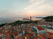 Panoramic photo about piran's old town in Slovenia Amazing morning lights in this peninsula with the Zvonik Campanile Bell Tower what is the landmark this town.