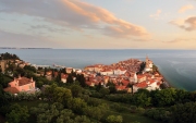 Panoramic photo about piran's old town in Slovenia Amazing morning lights in this peninsula with the Zvonik Campanile Bell Tower what is the landmark this town.