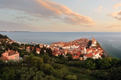 Panoramic photo about piran's old town in Slovenia Amazing morning lights in this peninsula with the Zvonik Campanile Bell Tower what is the landmark this town.