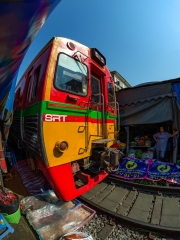 Maeklong Railway Market, a local market commonly called Siang Tai (life-risking) Market. Spreading over a 100-metre length, the market is located by the railway near Mae Klong Railway Station