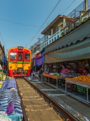Maeklong Railway Market, a local market commonly called Siang Tai (life-risking) Market. Spreading over a 100-metre length, the market is located by the railway near Mae Klong Railway Station