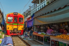 Maeklong Railway Market, a local market commonly called Siang Tai (life-risking) Market. Spreading over a 100-metre length, the market is located by the railway near Mae Klong Railway Station