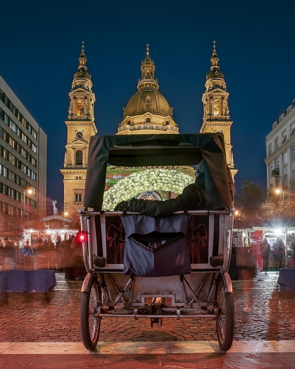 St Stephen square chritmas market and bike taxi. Famous traditional xmas market in budapest.