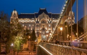 Blue hour in Budapest with Chain bridge. Including Danube river and Gresham palace. St Stephen basilica appear in the background.