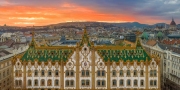 Amazing roof in Budapest, Hungary. State Treasury building with Hungarian Parliament in winter time.  All tiles on the roof made from the world famous Zsolnay pyro granite.