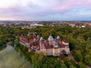 Amazing aerial view about the Vajdahunyad castle in the city park of Budapest Hungary. This gothic stlye historical builing it has next to Szechenyi thremal bath. Famous popular tourist attraction