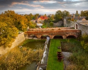 Castle of Tata city in Hungary. Amazing water fort next to Old lake. Built in 13th century. Beautiful dramatic sunrise view.